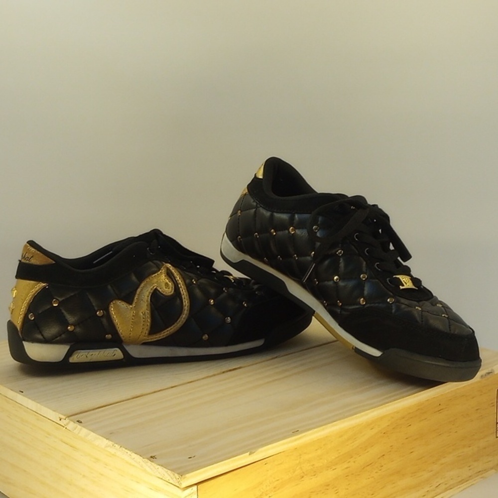 Size 7 Baby Phat sneakers, black with gold details